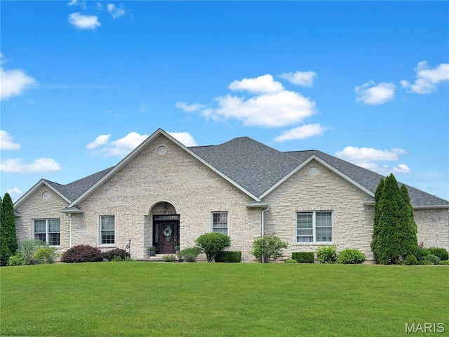 495 Oak Field Ct, Washington, MO 63090 - view of front of house featuring a front yard, a shingled roof, and stone siding