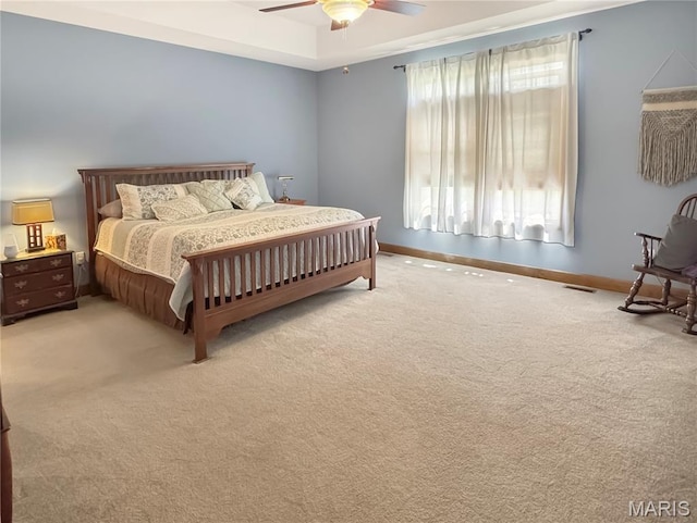 495 Oak Field Ct, Washington, MO 63090 - bedroom with light colored carpet, baseboards, and a ceiling fan