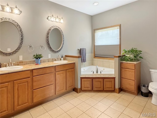 495 Oak Field Ct, Washington, MO 63090 - full bathroom featuring toilet, double vanity, a tub with jets, and tile patterned floors