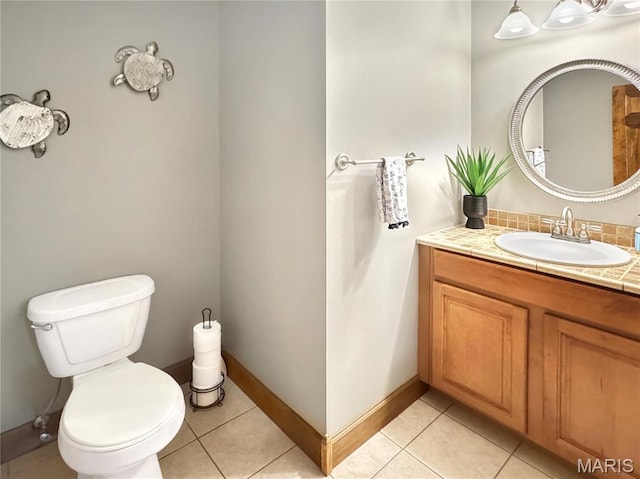 495 Oak Field Ct, Washington, MO 63090 - bathroom featuring vanity, toilet, baseboards, and tile patterned flooring
