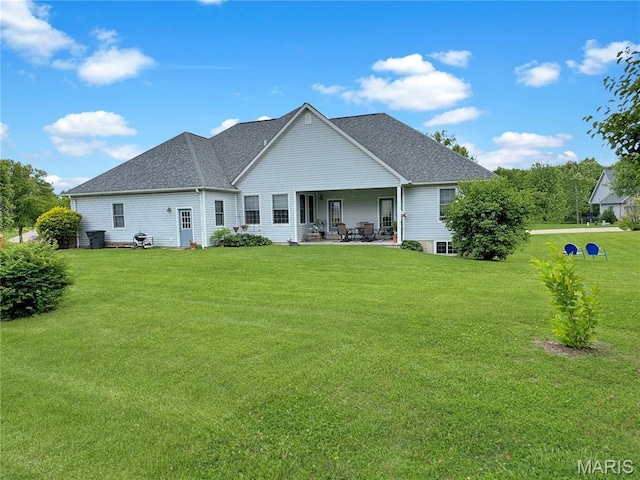 495 Oak Field Ct, Washington, MO 63090 - back of house featuring a patio area, a yard, and a shingled roof