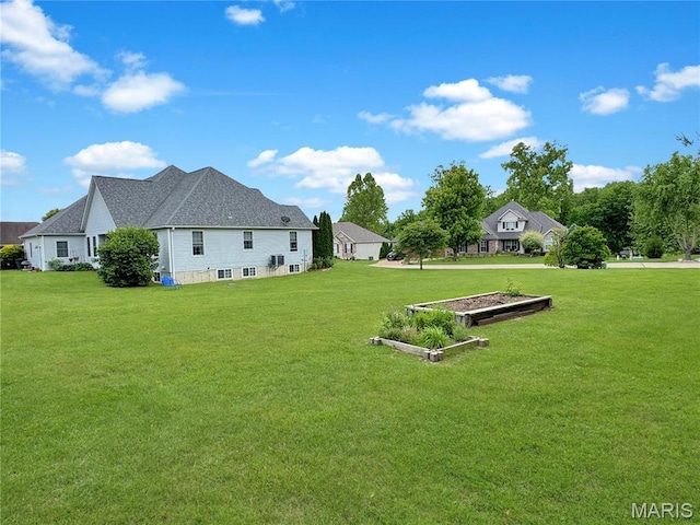 495 Oak Field Ct, Washington, MO 63090 - view of green lawn featuring a garden