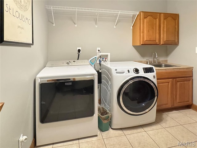 495 Oak Field Ct, Washington, MO 63090 - laundry area with independent washer and dryer, cabinet space, and light tile patterned floors