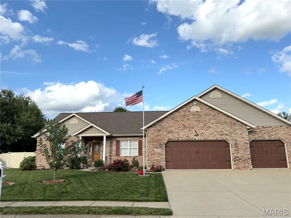 1210 Hamlin Ct, Ofallon, IL 62269 - view of front facade featuring a garage, driveway, and brick siding