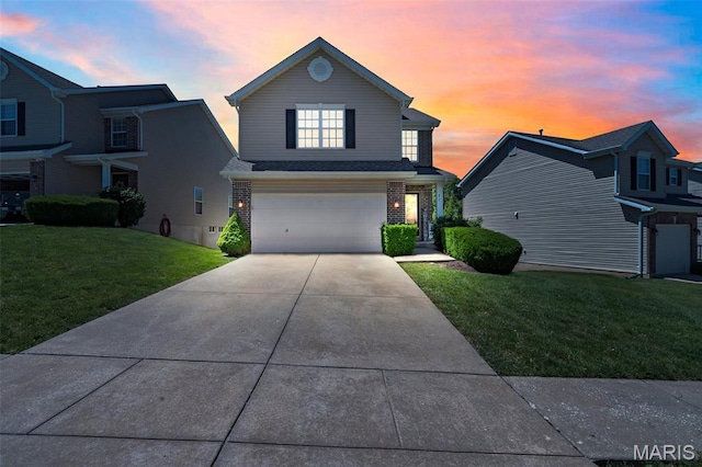 27 Brushy Brook Ct, Ofallon, MO 63366 - traditional-style house featuring a front lawn, an attached garage, driveway, and brick siding