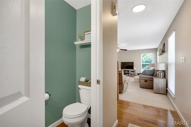 27 Brushy Brook Ct, Ofallon, MO 63366 - bathroom with wood finished floors, toilet, a ceiling fan, and baseboards