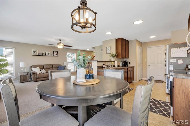 27 Brushy Brook Ct, Ofallon, MO 63366 - dining room with healthy amount of natural light, a chandelier, ceiling fan, recessed lighting, and light tile patterned flooring