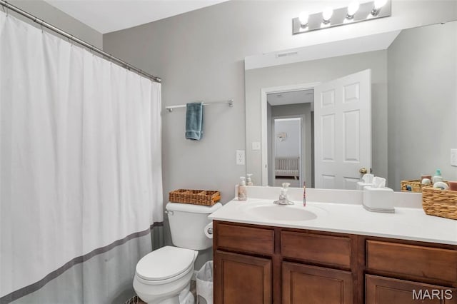 27 Brushy Brook Ct, Ofallon, MO 63366 - bathroom with toilet, vanity, curtained shower, and radiator