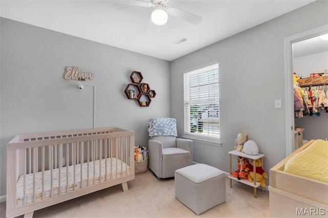 27 Brushy Brook Ct, Ofallon, MO 63366 - bedroom with light colored carpet, a ceiling fan, and a crib