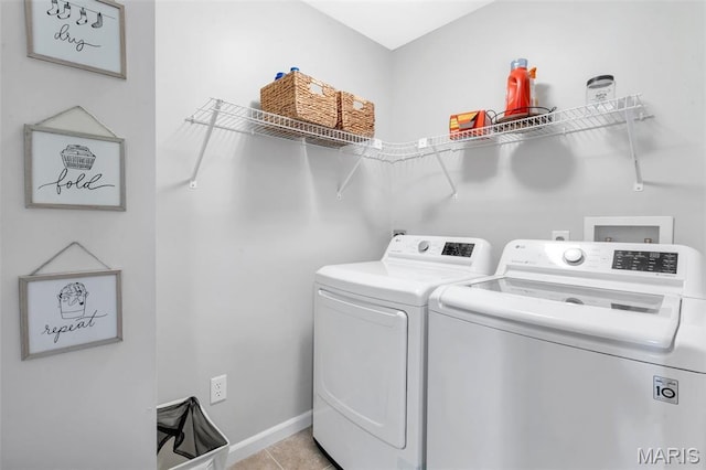 27 Brushy Brook Ct, Ofallon, MO 63366 - laundry room with washer and dryer, baseboards, and light tile patterned flooring