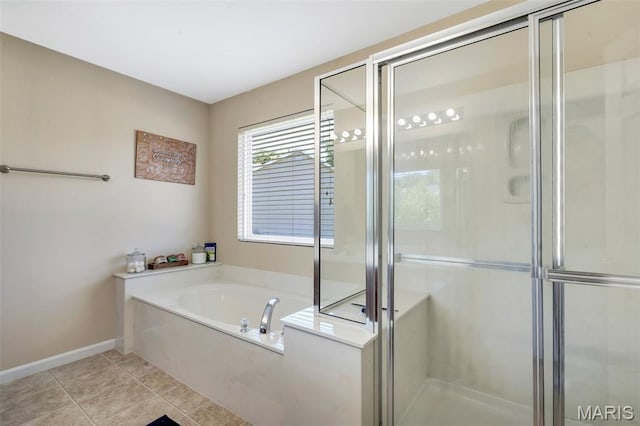 27 Brushy Brook Ct, Ofallon, MO 63366 - bathroom with a stall shower, a bath, baseboards, and tile patterned floors
