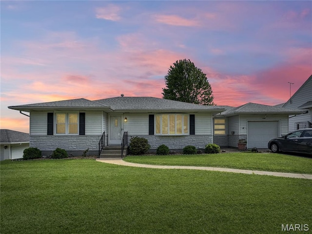 1508 3rd Pkwy, Washington, MO 63090 - ranch-style house with an attached garage, stone siding, and a front lawn