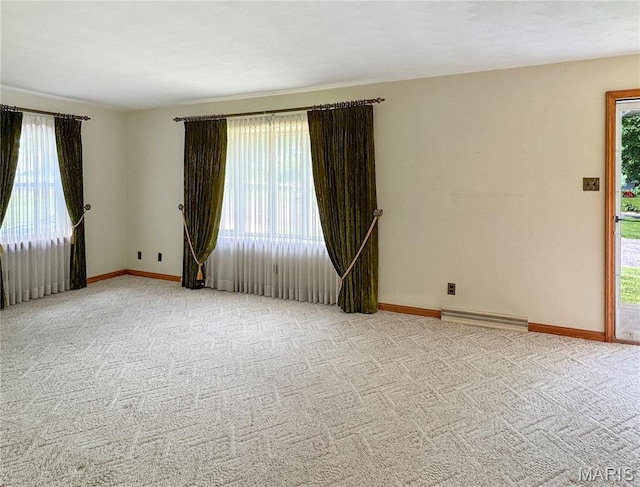 1508 3rd Pkwy, Washington, MO 63090 - spare room featuring plenty of natural light, baseboards, and carpet