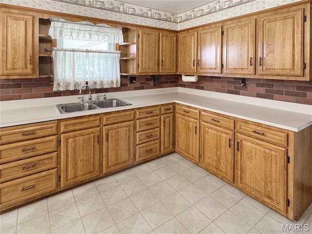1508 3rd Pkwy, Washington, MO 63090 - kitchen featuring open shelves, a sink, wallpapered walls, brown cabinetry, and light countertops