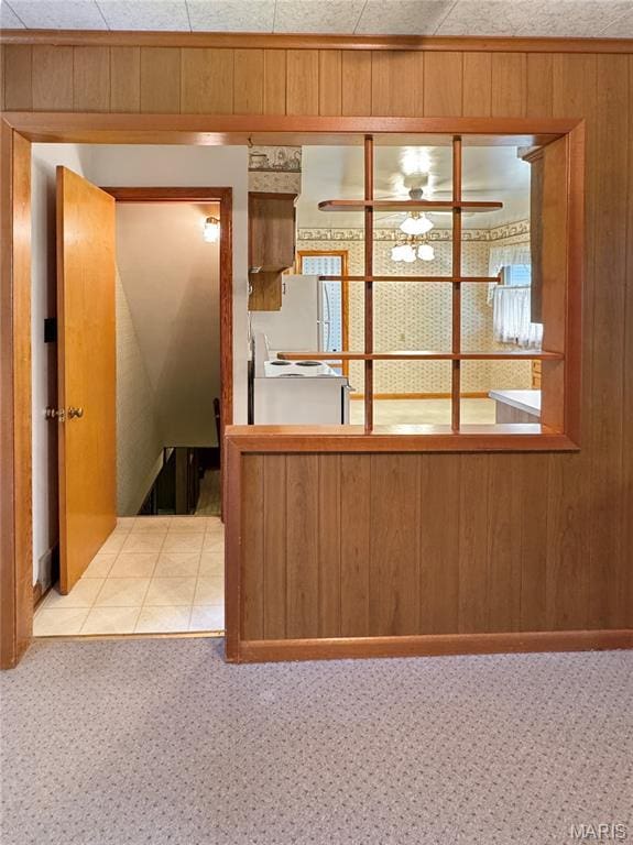 1508 3rd Pkwy, Washington, MO 63090 - kitchen featuring wooden walls, carpet flooring, and ceiling fan