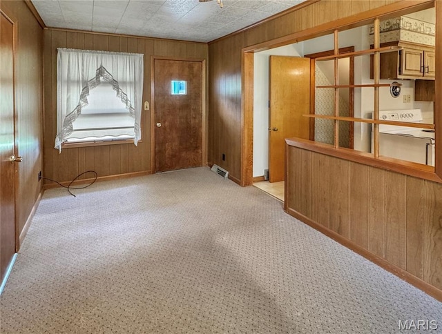 1508 3rd Pkwy, Washington, MO 63090 - foyer featuring wooden walls, light colored carpet, and baseboards