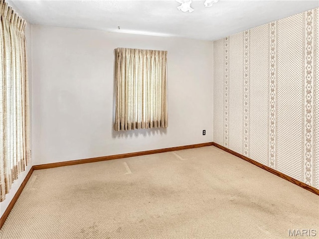 1508 3rd Pkwy, Washington, MO 63090 - carpeted spare room featuring baseboards