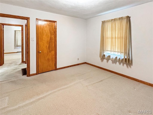 1508 3rd Pkwy, Washington, MO 63090 - spare room featuring light colored carpet and baseboards