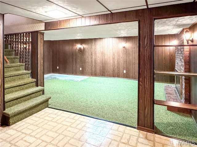 1508 3rd Pkwy, Washington, MO 63090 - finished below grade area with wood walls, stairway, and brick patterned flooring