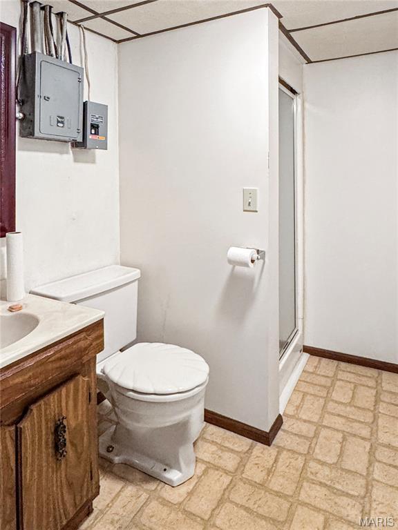 1508 3rd Pkwy, Washington, MO 63090 - full bathroom with baseboards, toilet, vanity, and a stall shower