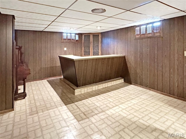 1508 3rd Pkwy, Washington, MO 63090 - bar with a drop ceiling, brick patterned flooring, and wooden walls