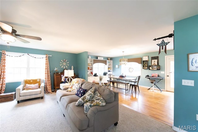 15701 County Road 1130, St James, MO 65559 - living room featuring ceiling fan, carpet floors, and wood finished floors