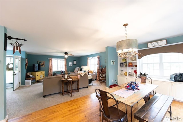 15701 County Road 1130, St James, MO 65559 - dining area with a chandelier, light wood-type flooring, and ceiling fan