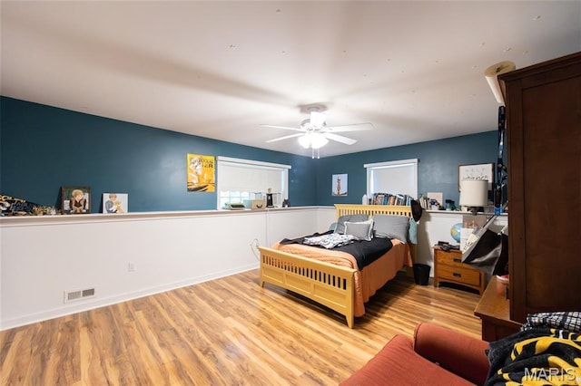 15701 County Road 1130, St James, MO 65559 - bedroom featuring wood finished floors and a ceiling fan