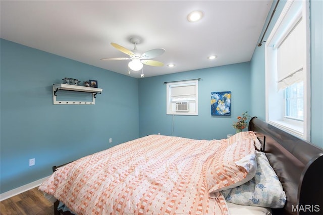 15701 County Road 1130, St James, MO 65559 - bedroom featuring multiple windows, dark wood-style floors, cooling unit, recessed lighting, and ceiling fan