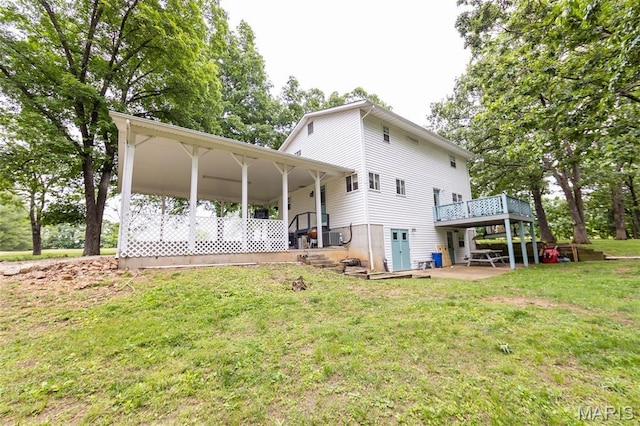 15701 County Road 1130, St James, MO 65559 - back of house with a lawn and a wooden deck