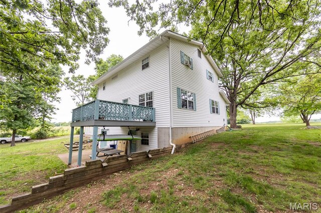 15701 County Road 1130, St James, MO 65559 - back of property featuring a yard, a wooden deck, and a patio area
