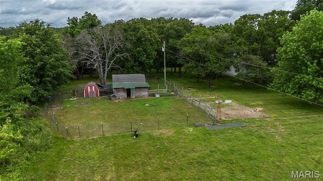 15701 County Road 1130, St James, MO 65559 - view of yard featuring a storage unit and a forest view