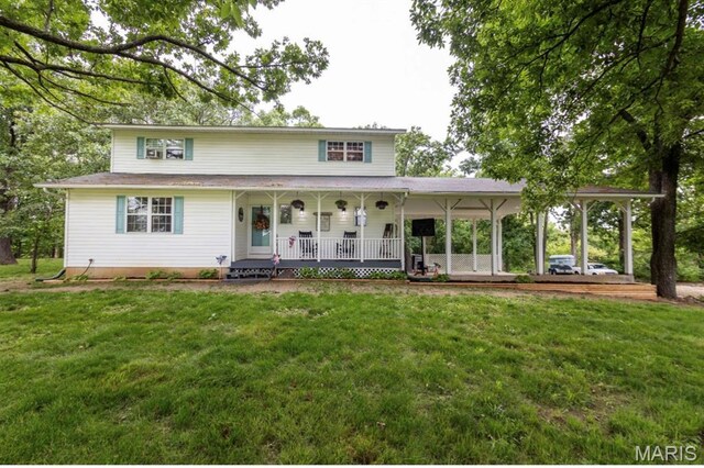 15701 County Road 1130, St James, MO 65559 - farmhouse with a porch and a front lawn