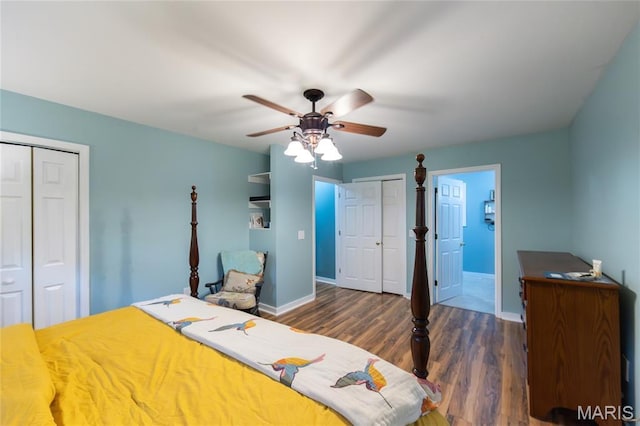 15701 County Road 1130, St James, MO 65559 - bedroom with dark wood-style flooring, multiple closets, and a ceiling fan