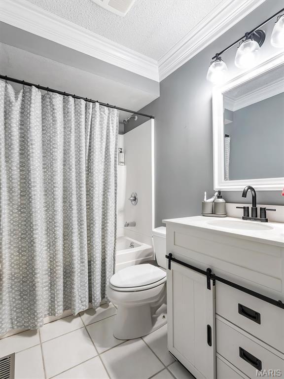 1015 Marilyn Ct, Washington, MO 63090 - full bath with tile patterned flooring, vanity, ornamental molding, shower / bath combo, and a textured ceiling