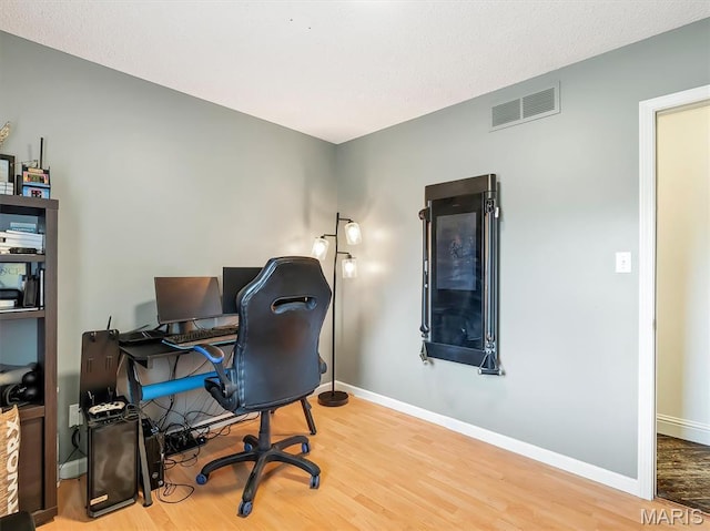 1015 Marilyn Ct, Washington, MO 63090 - office area featuring wood finished floors and baseboards