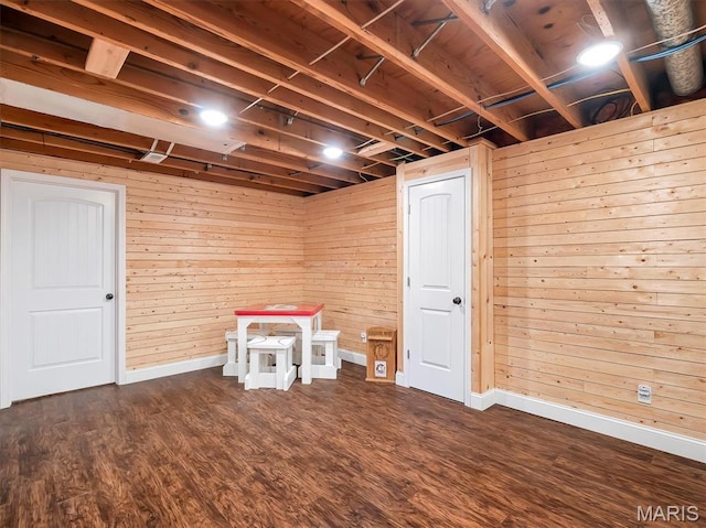 1015 Marilyn Ct, Washington, MO 63090 - finished basement featuring dark wood-style flooring and wood walls