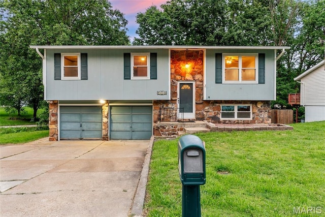 4618 Towne Hall Dr, Arnold, MO 63010 - raised ranch with stone siding, a yard, an attached garage, and driveway