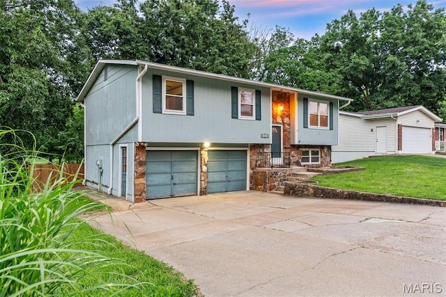 4618 Towne Hall Dr, Arnold, MO 63010 - raised ranch featuring concrete driveway, an attached garage, and stone siding