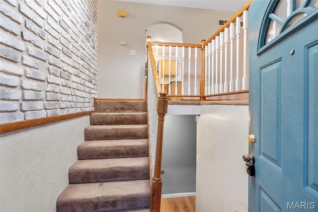 4618 Towne Hall Dr, Arnold, MO 63010 - staircase with wood finished floors and arched walkways