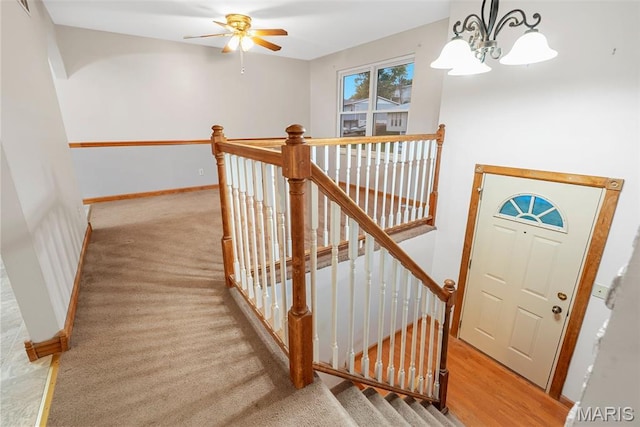 4618 Towne Hall Dr, Arnold, MO 63010 - staircase featuring a chandelier, baseboards, ceiling fan, and carpet flooring