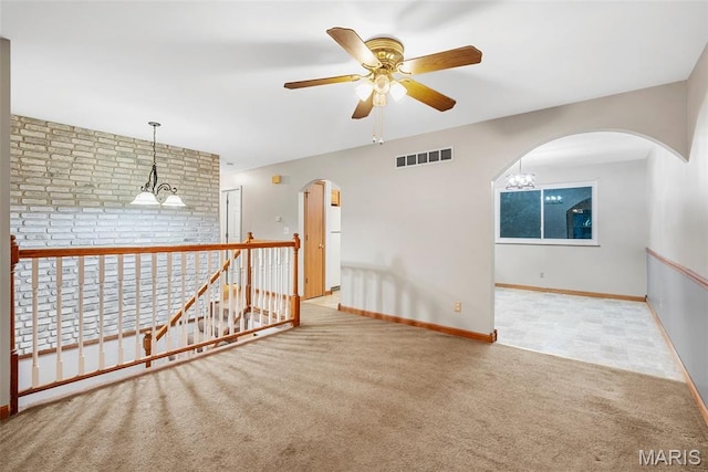 4618 Towne Hall Dr, Arnold, MO 63010 - carpeted empty room with a ceiling fan, arched walkways, and baseboards