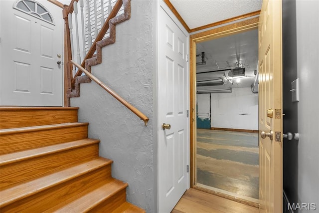 4618 Towne Hall Dr, Arnold, MO 63010 - staircase featuring wood finished floors and a textured wall