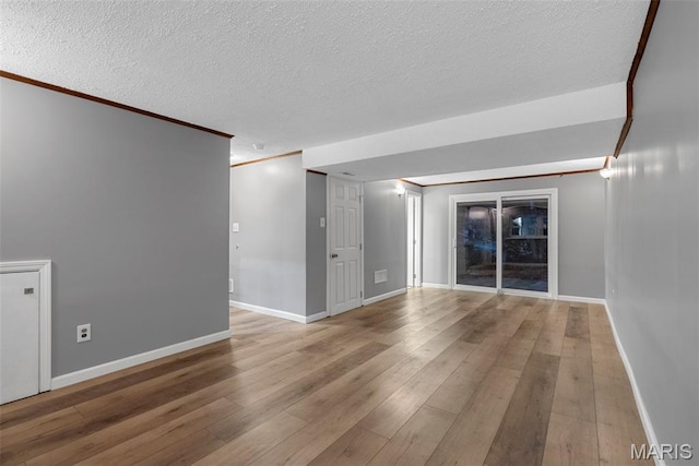 4618 Towne Hall Dr, Arnold, MO 63010 - spare room with a textured ceiling, wood finished floors, crown molding, and baseboards