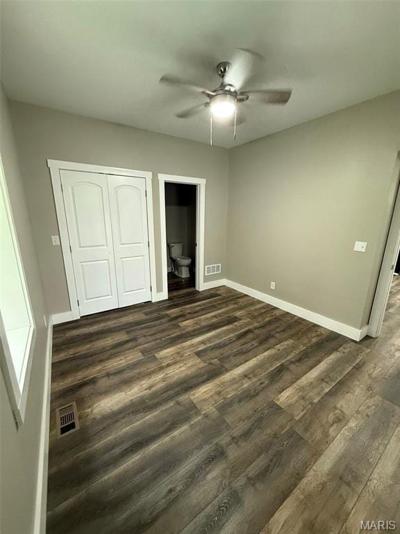 618 Taylor Ave, Park Hills, MO 63601 - unfurnished bedroom with dark wood-style floors, baseboards, a closet, ceiling fan, and connected bathroom