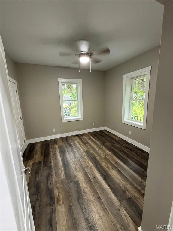 618 Taylor Ave, Park Hills, MO 63601 - spare room featuring dark wood-style floors, baseboards, and a ceiling fan
