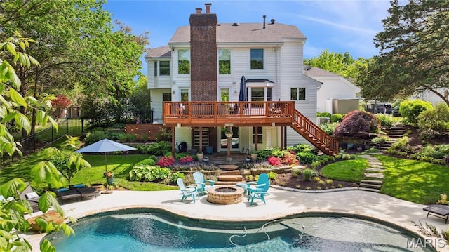 16223 Pepper View Ct, Wildwood, MO 63005 - back of property featuring stairs, an outdoor fire pit, a wooden deck, a patio, and a chimney
