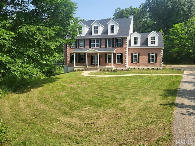 17917 Rosemar Ln, Wildwood, MO 63038 - view of front of house featuring covered porch, a front lawn, and brick siding