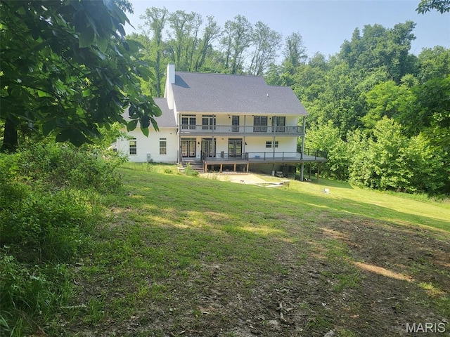 17917 Rosemar Ln, Wildwood, MO 63038 - rear view of property with a lawn, a chimney, and a balcony