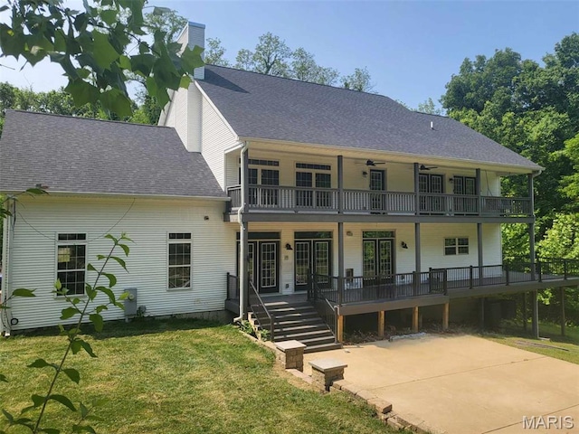17917 Rosemar Ln, Wildwood, MO 63038 - view of front facade with a balcony, a front yard, ceiling fan, roof with shingles, and a chimney
